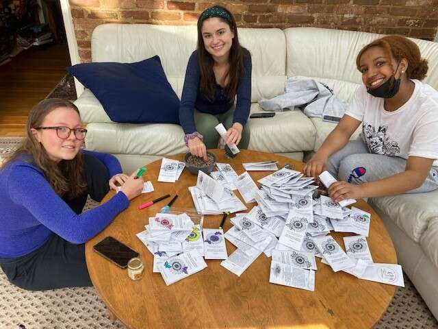 Folks coloring on native seed packets
