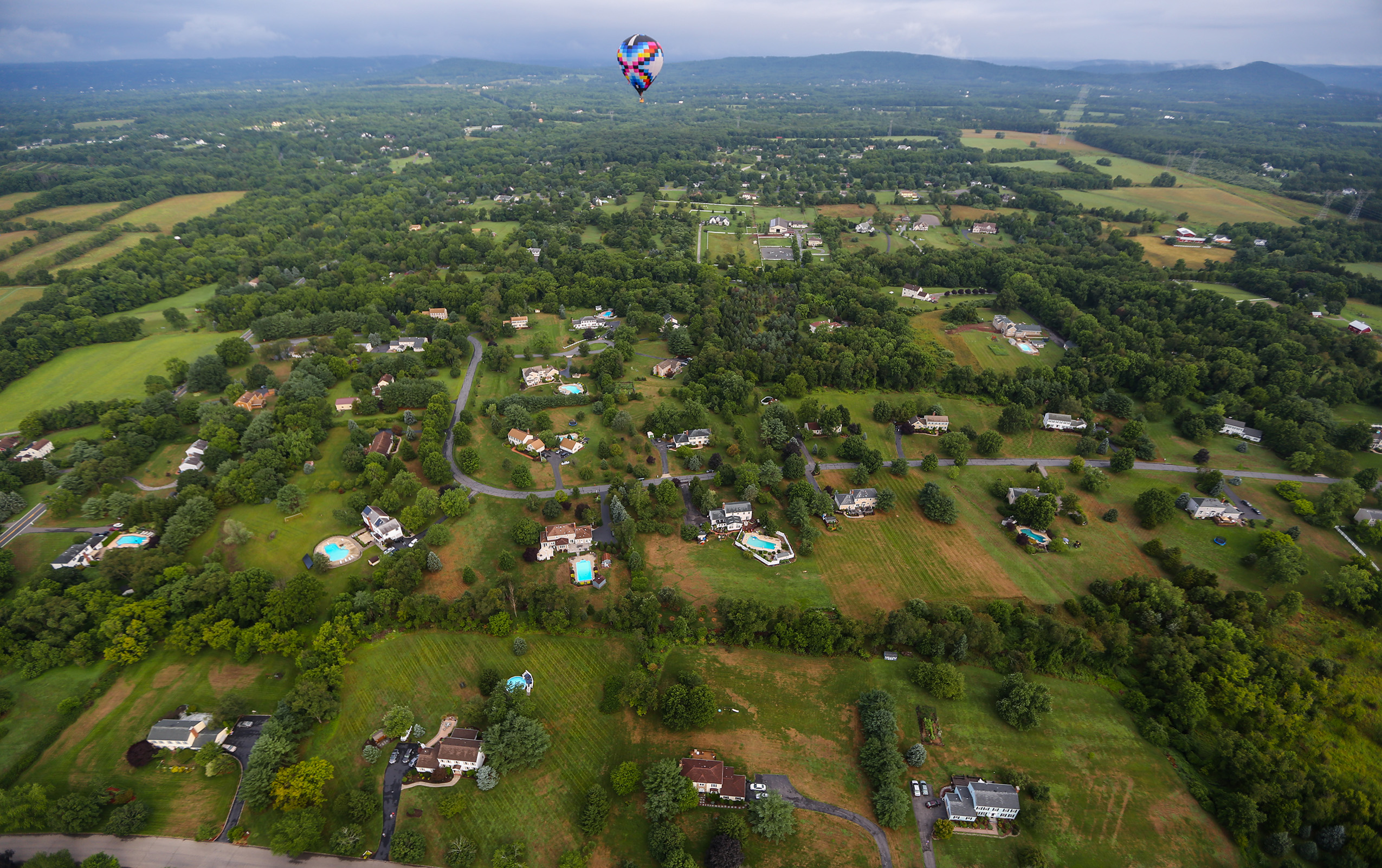 Looking down on the landscape of New Jersey, the loss of forest to houses and gardens can be seen 