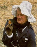 Joan Mosenthal Dewind holding a butterfly.