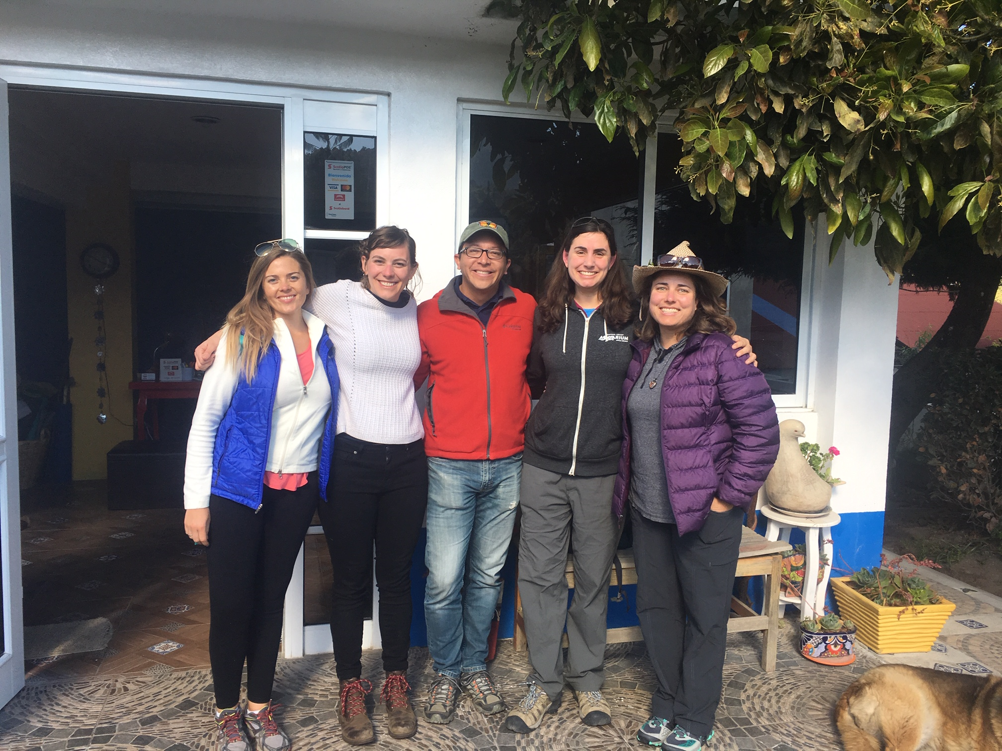 Emma Pelton, our monarch specialist, standing with other monarch sciences from around the world taking a group photo.