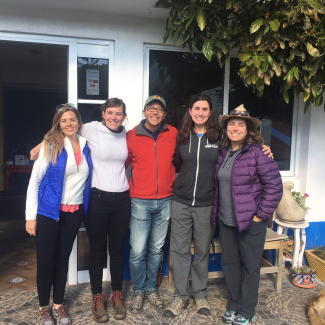 A group of scientists taking a photo together, including Emma Pelton, our monarch specialist.