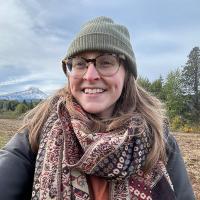 Nicole Spehn posed in front of an agricultural field